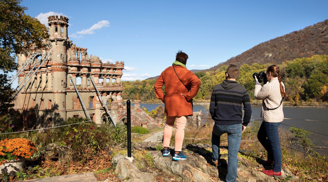Hikers exploring fall Bannerman Island