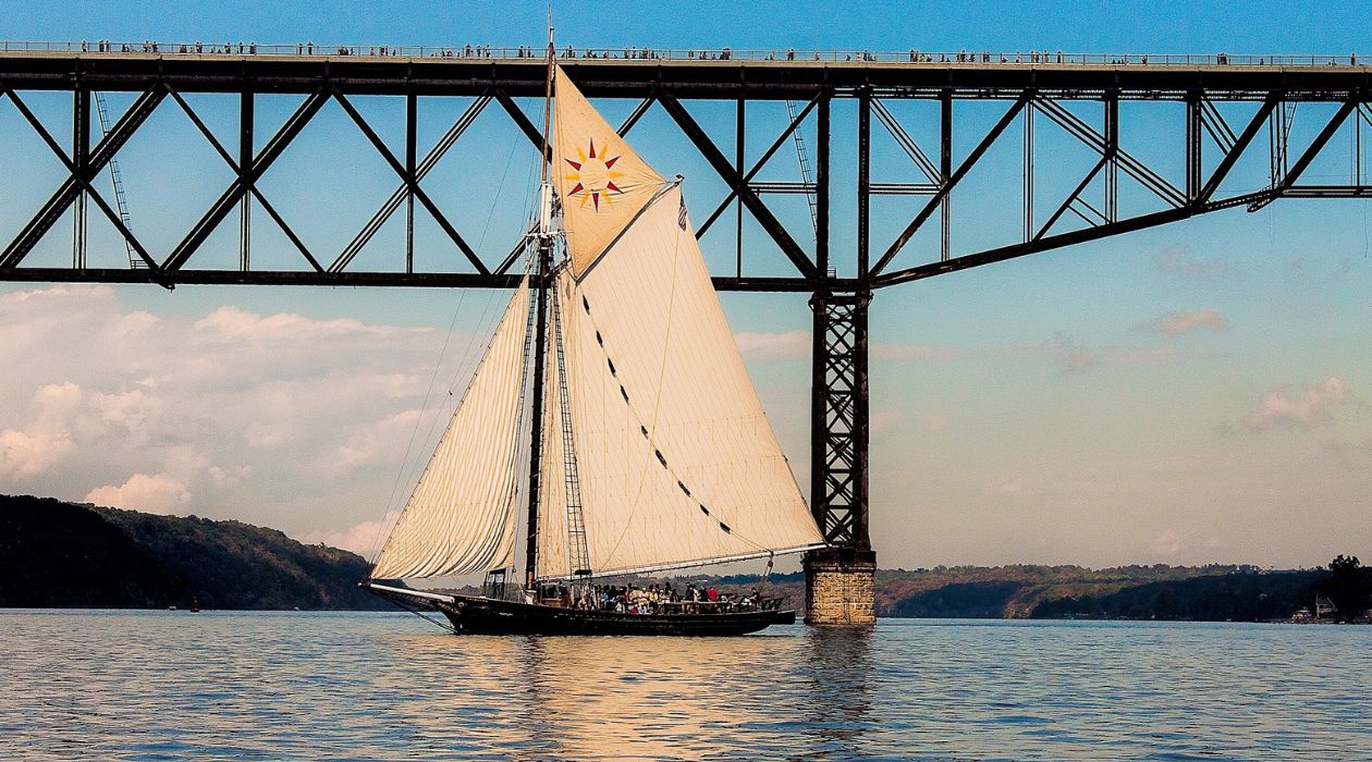 Sailboat under bridge in Hudson River