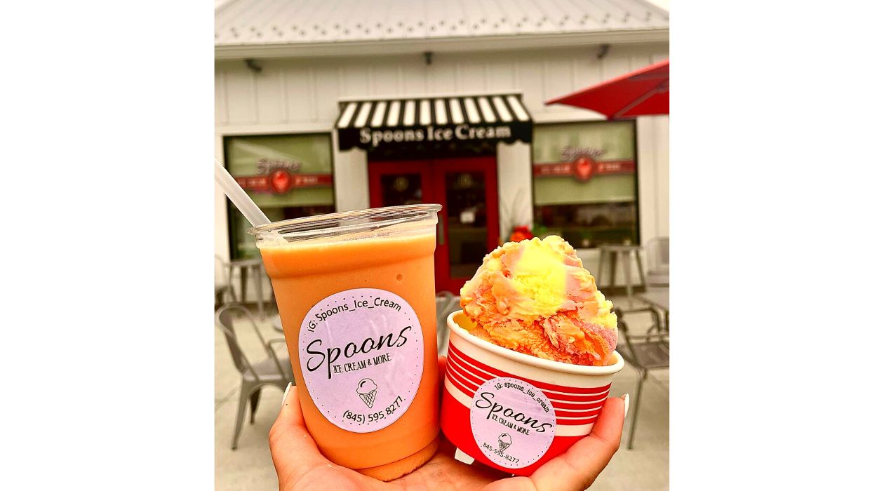 Holding cup of colorful sorbet at Spoons Poughkeepsie