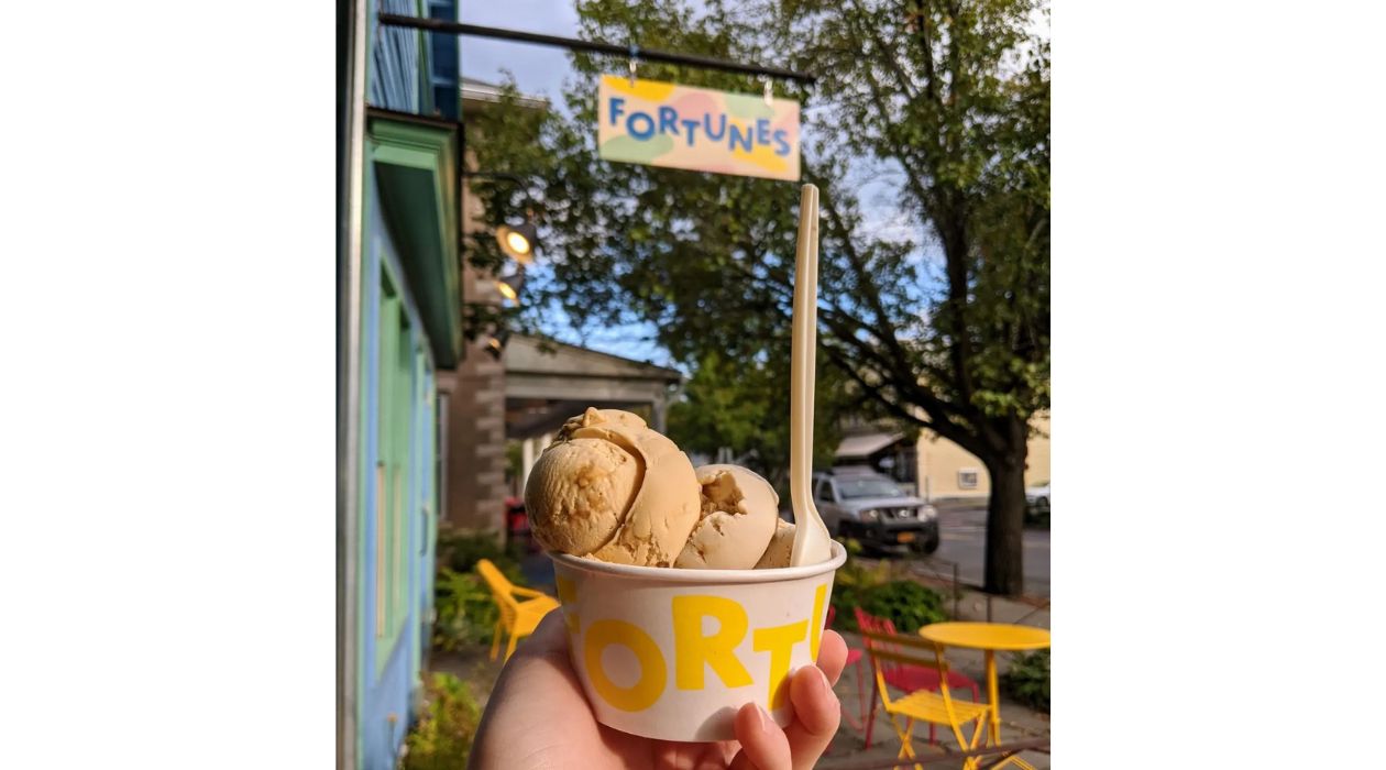 Hand holding cup of ice cream at Fortunes Ice Cream in Tivoli