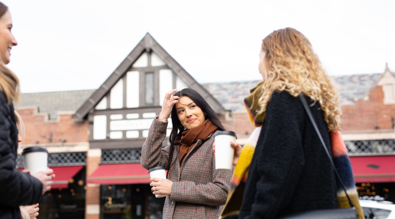 Two women enjoy coffee at Crafted Kup on the streets of Arlington Poughkeepsie