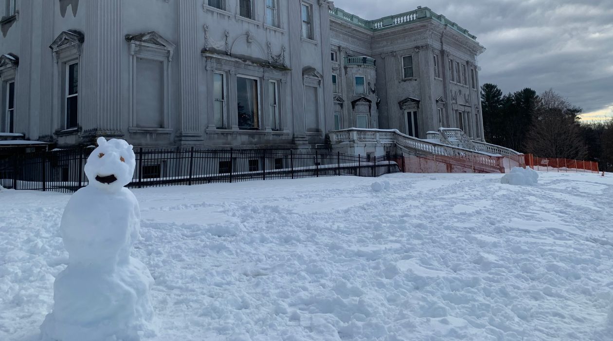 A snowman stands on the snow covered grounds outside the Mills Mansion at Staatsburgh State Historic Site, Staatsburg