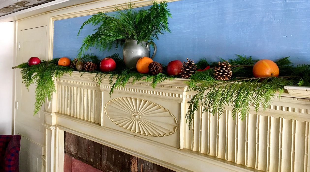 Holiday decorations at the Elmendorph Inn in Red Hook include evergreen branches and pine cones over the fireplace