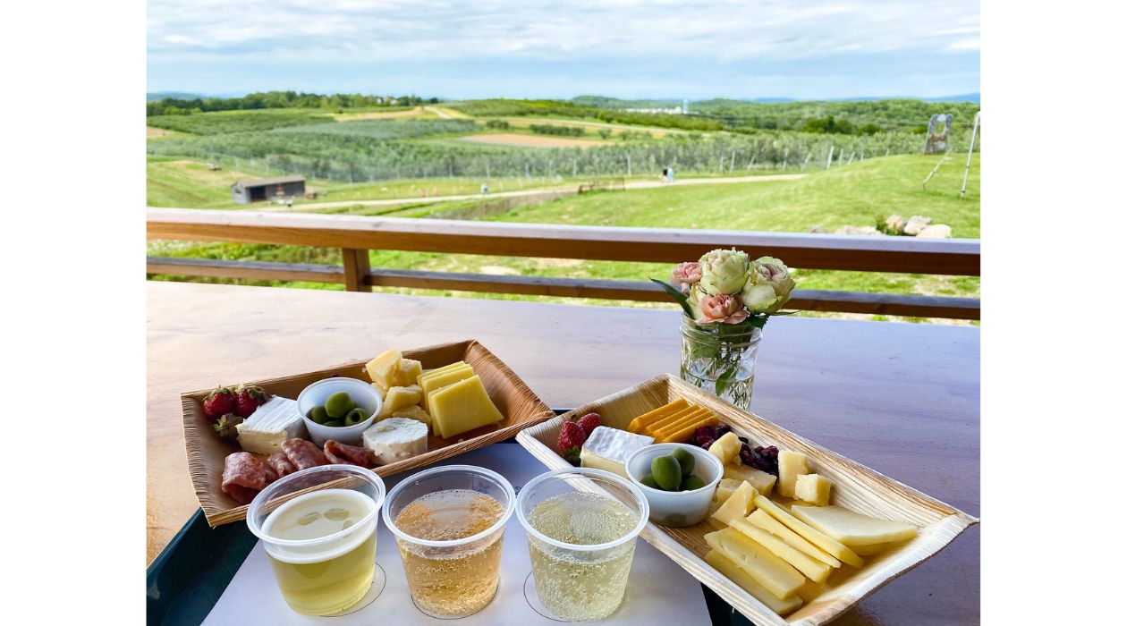 Cider flight next to cheese plate