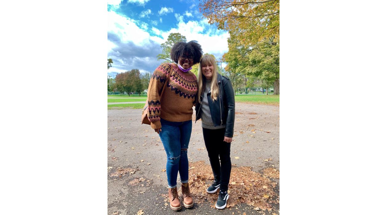 Two people wearing fleece sweaters Sheep and Wool