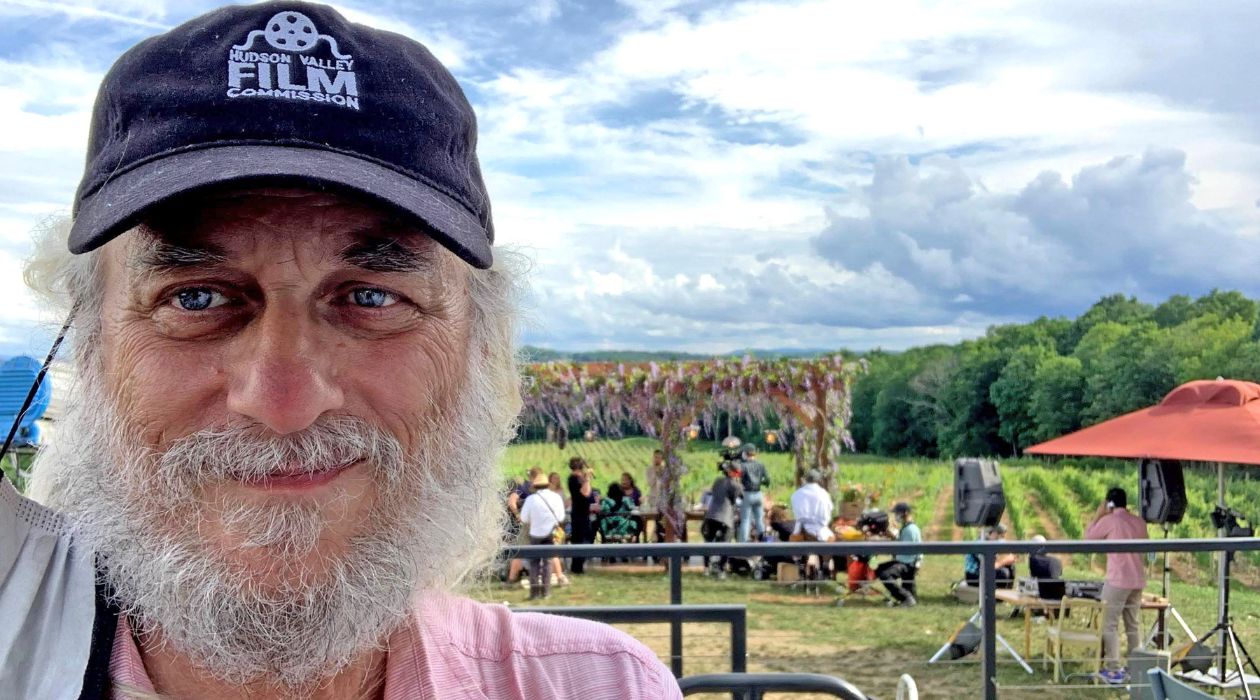 Man in front of film shoot at winery